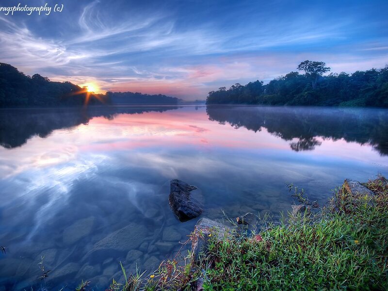 Sunrise over a misty lake