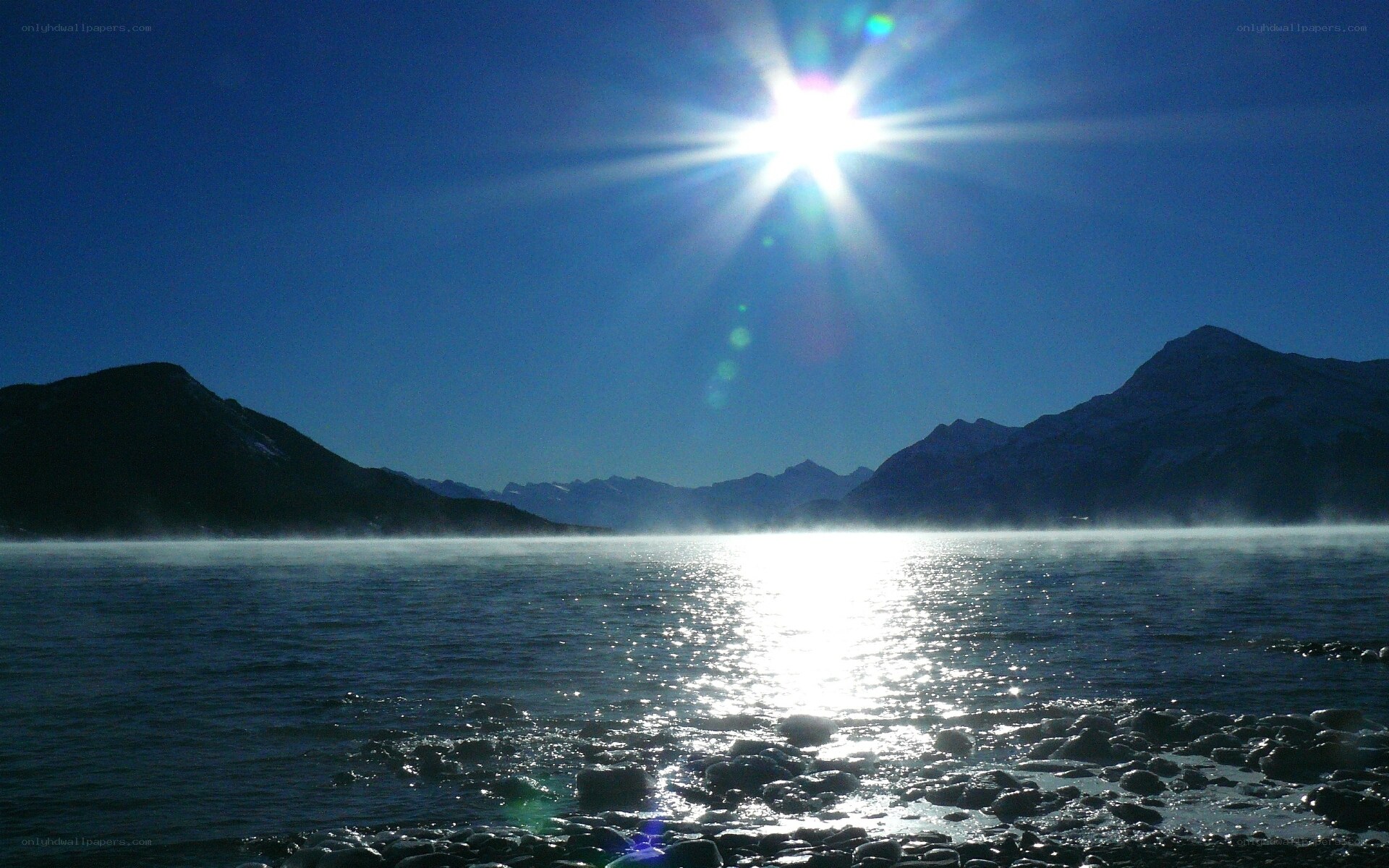 Sunrise over a misty lake