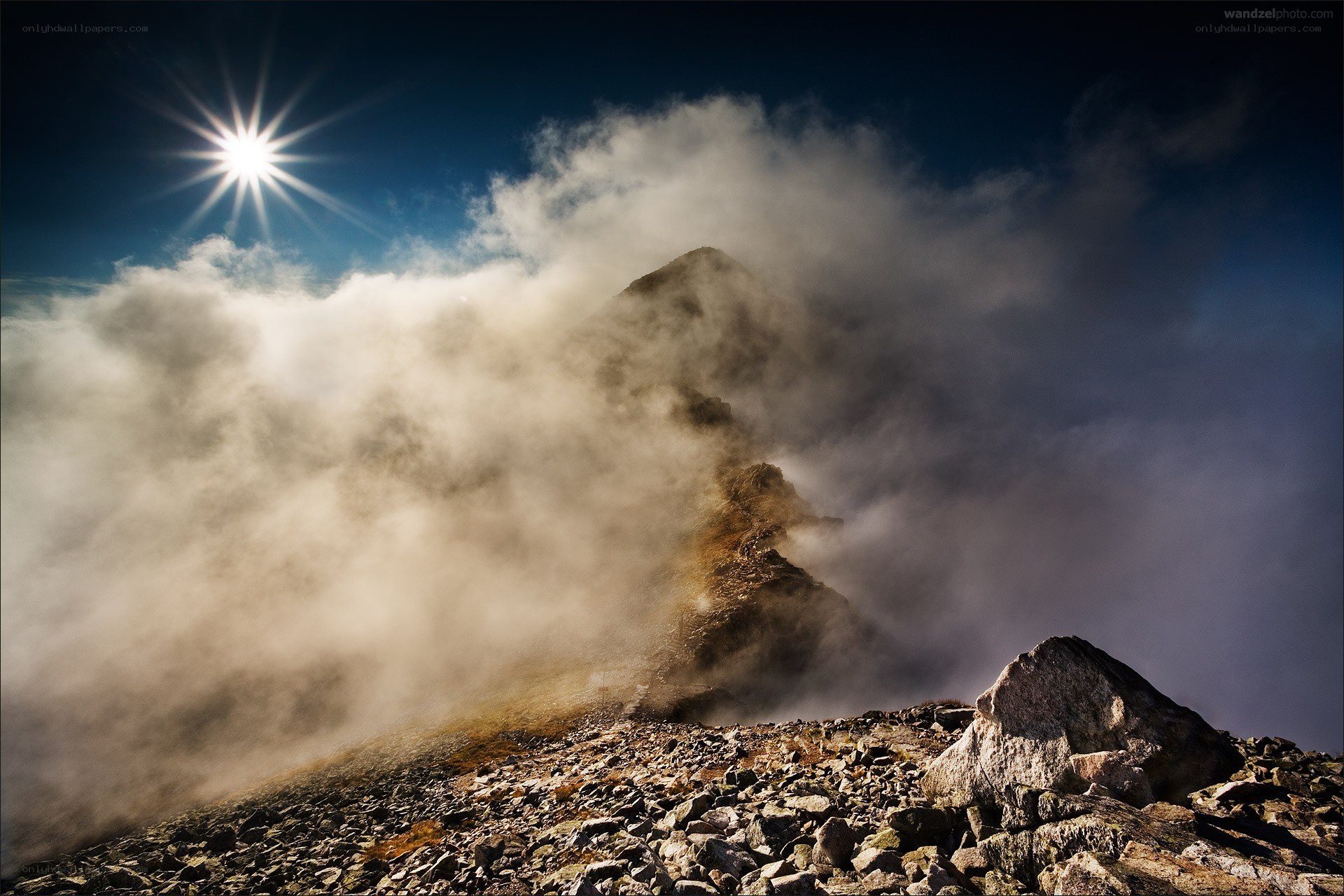 Sunrise over a misty mountain