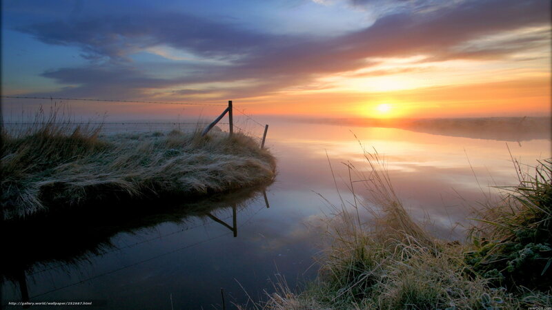 Sunrise over a misty river