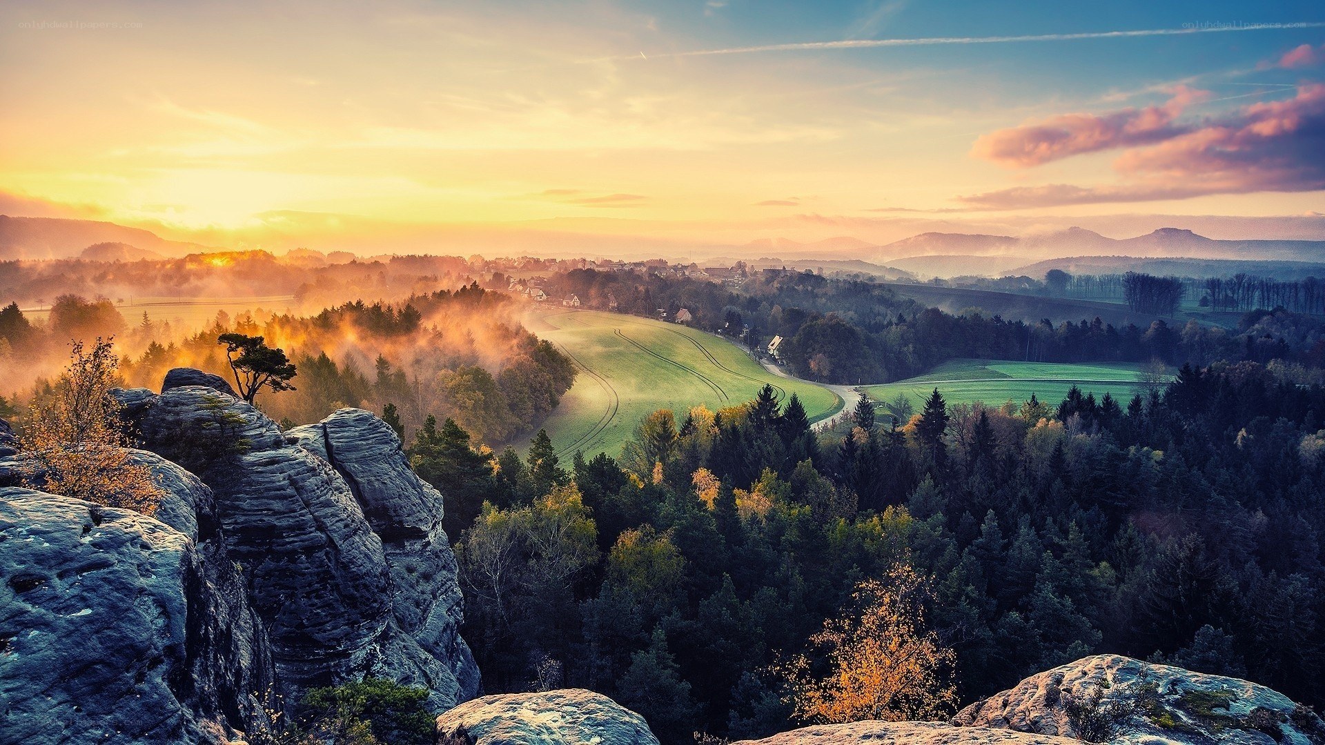 Sunrise over a misty valley