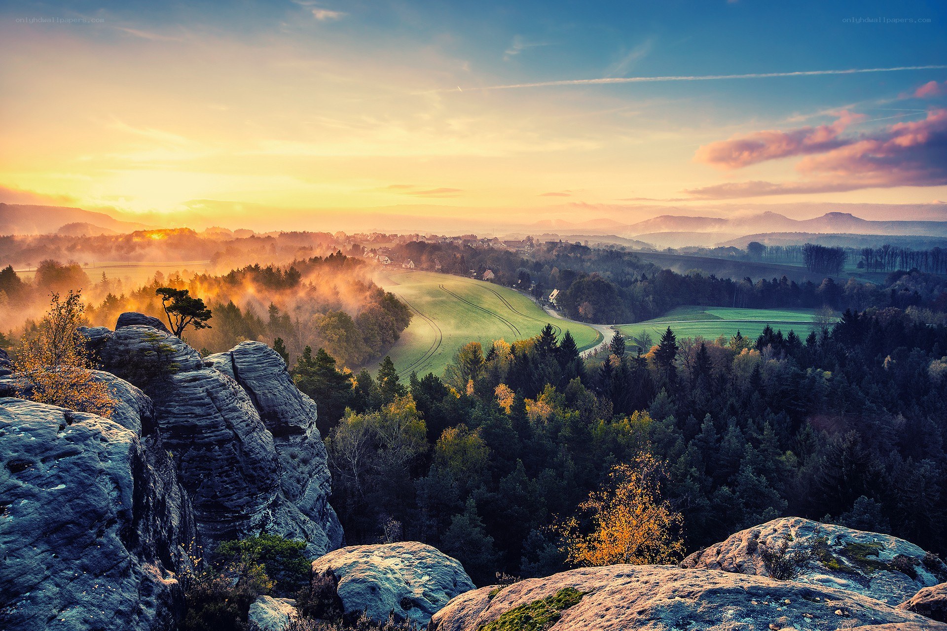 Sunrise over a misty valley