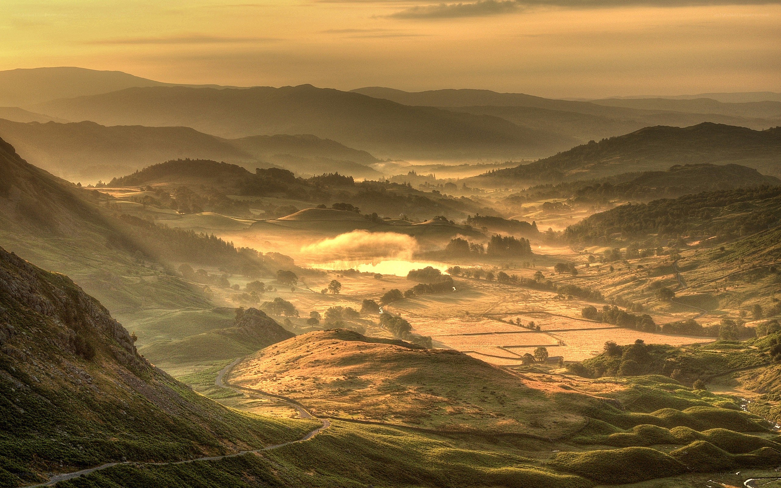 Sunrise over a misty valley