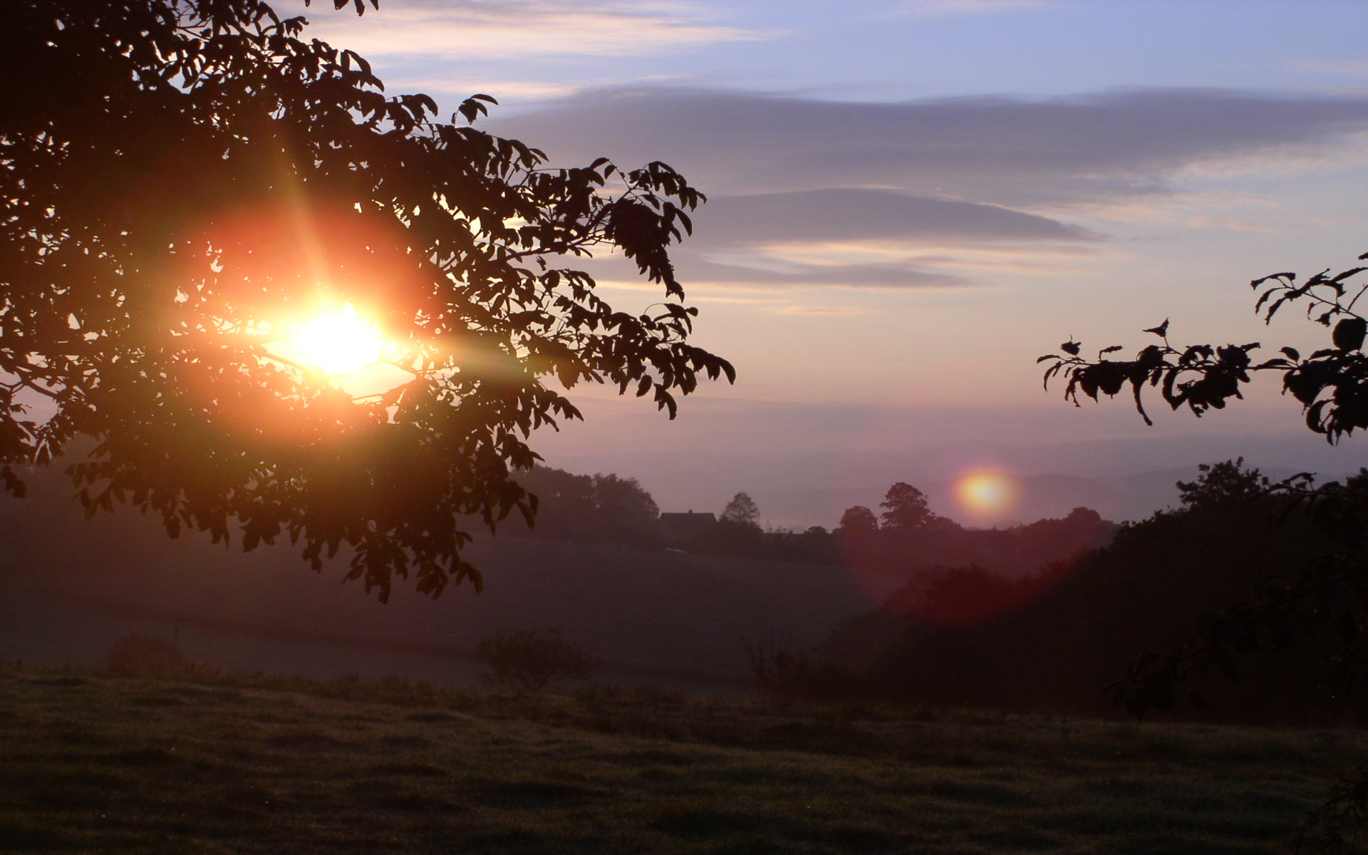 Sunrise over a misty valley