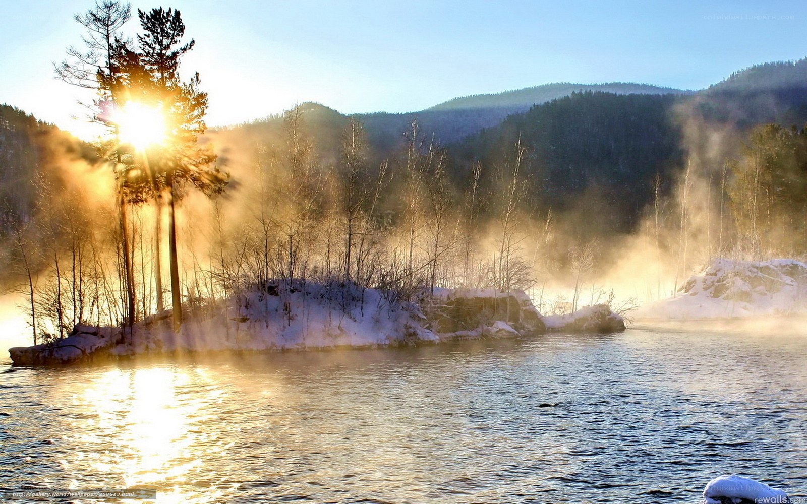 Sunrise over a misty winter river