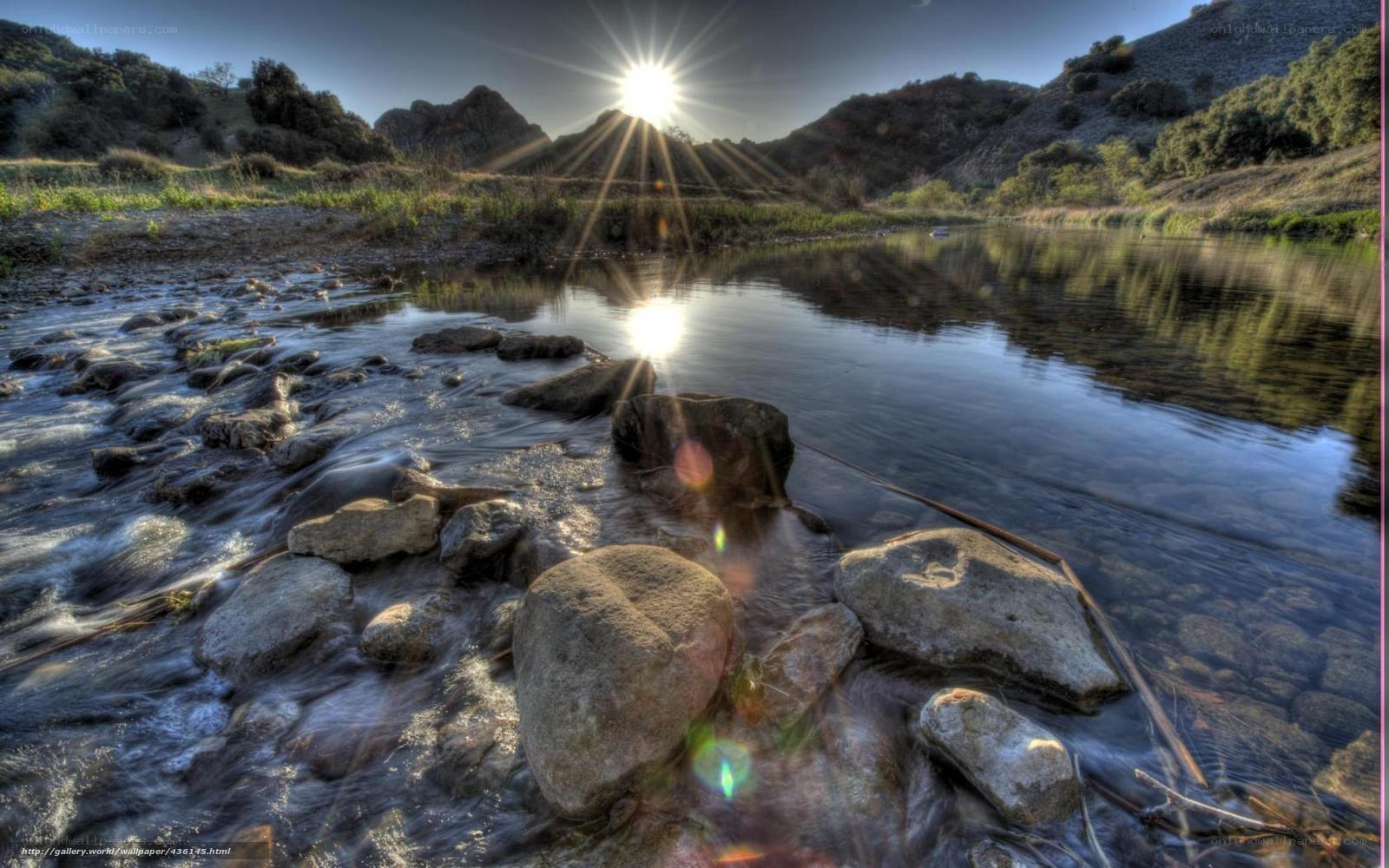 Sunrise over a river at dawn