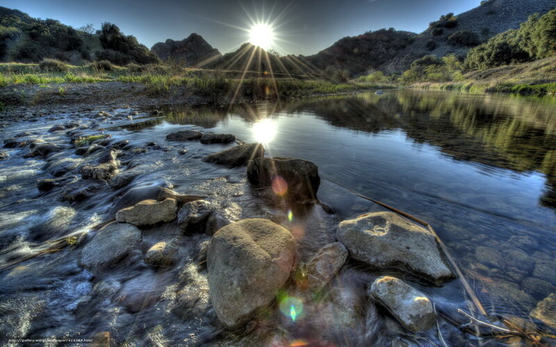 Sunrise over a rocky river