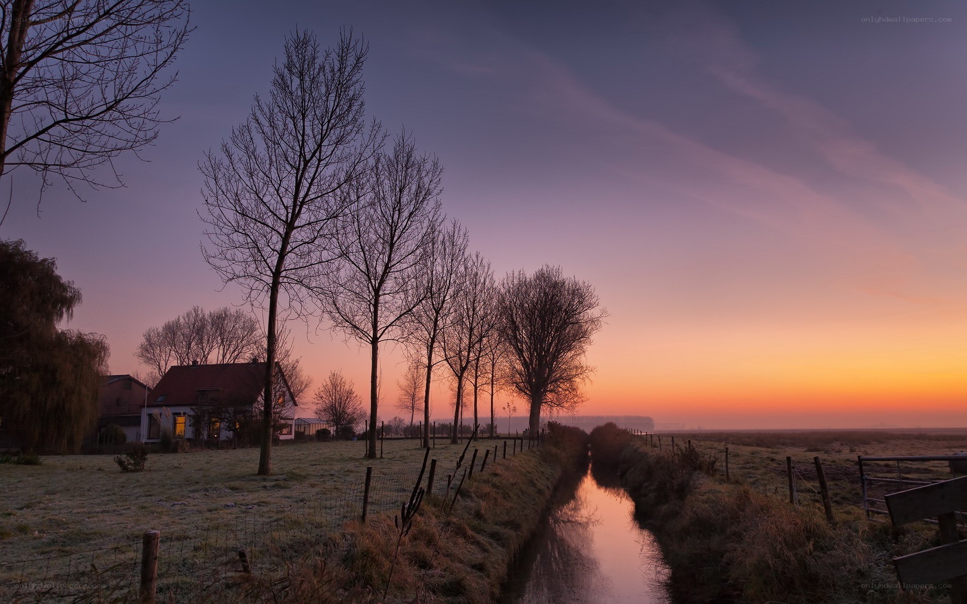 Sunrise over a rural canal