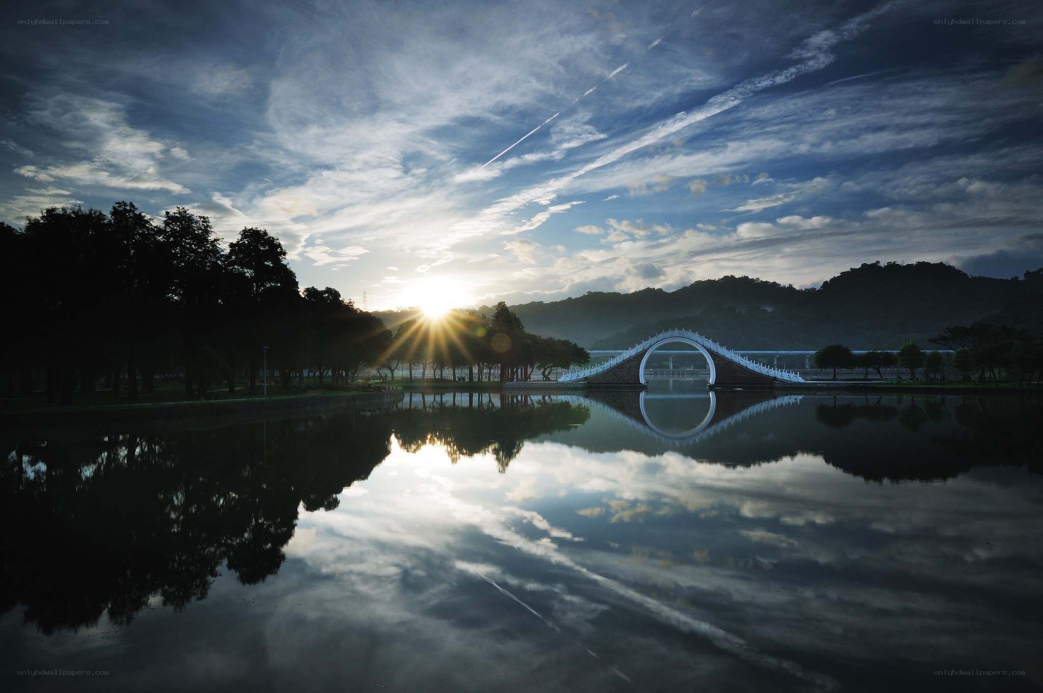 Sunrise over a serene lake