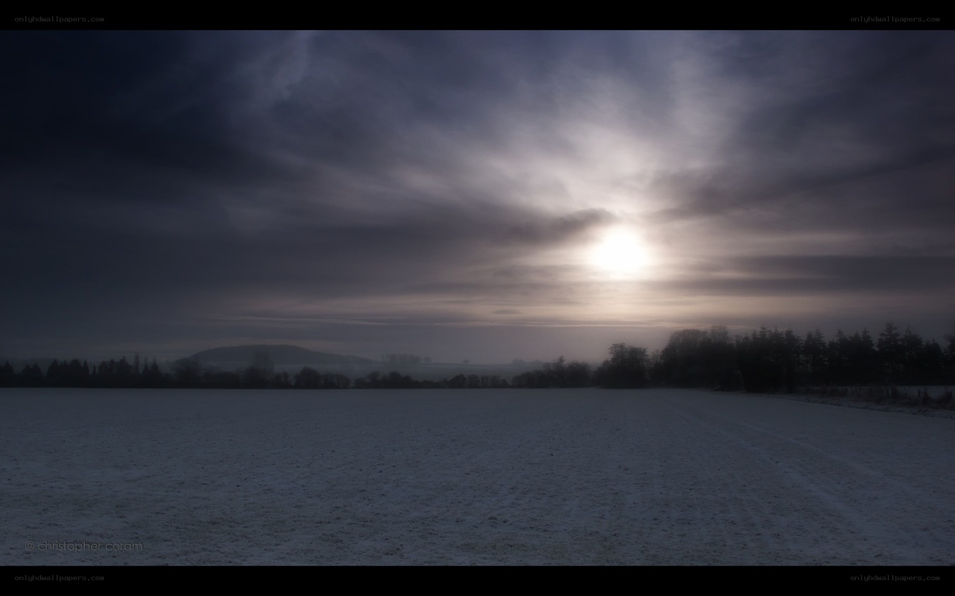 Sunrise over a snowy field