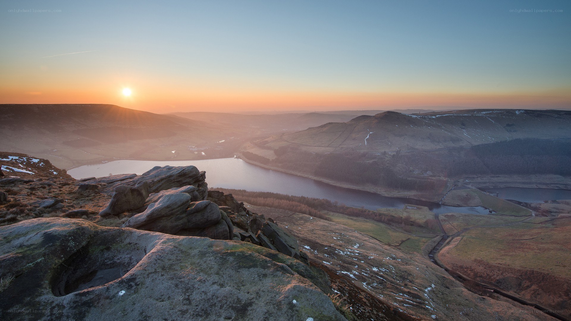 Sunrise over a valley lake
