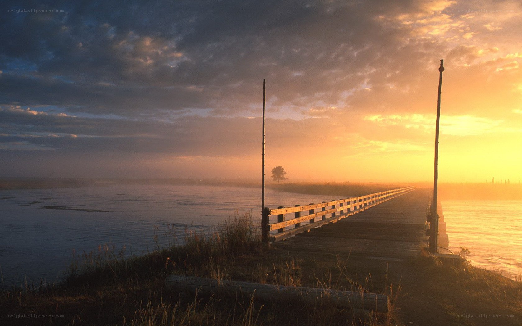 Sunrise over a wooden pier