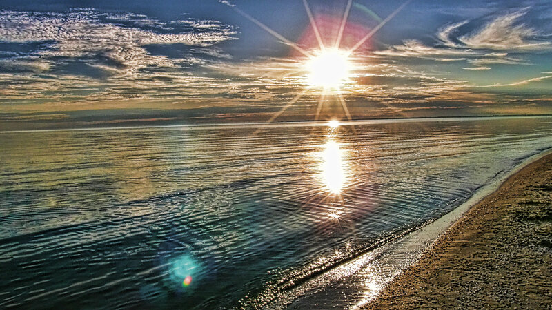 Sunrise over Calm Sea