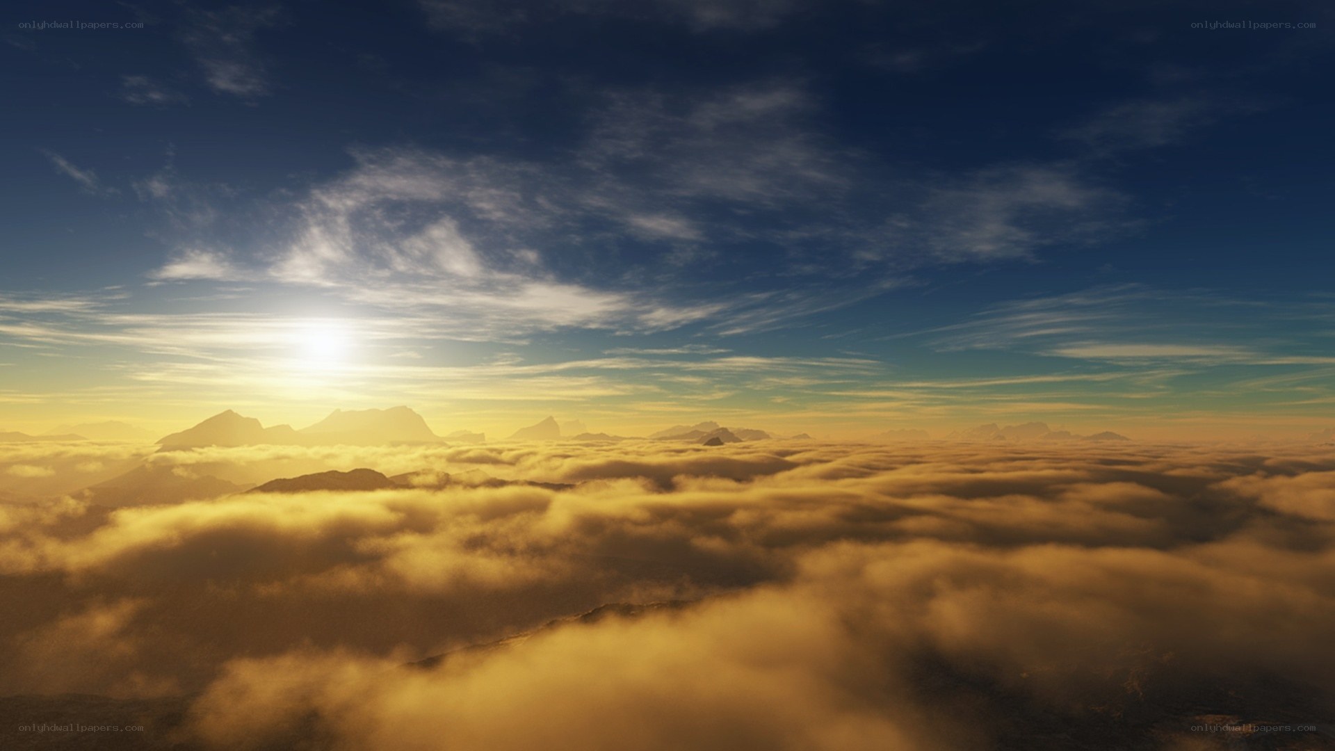 Sunrise over cloud-covered mountains