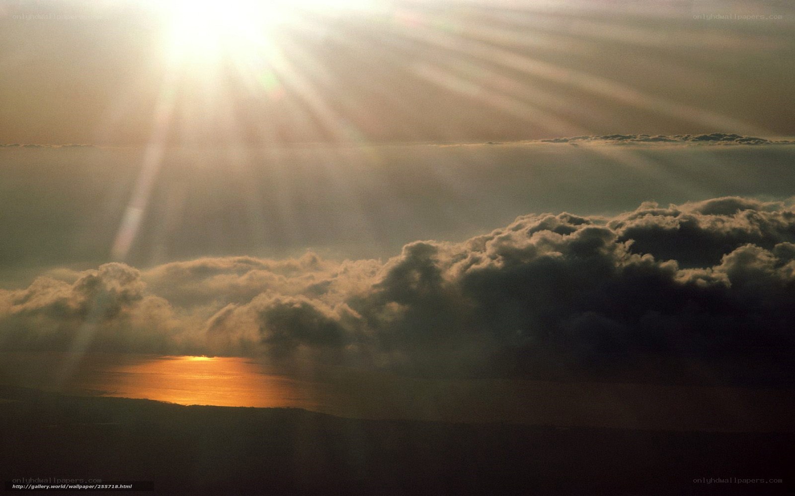 Sunrise over clouds and sea