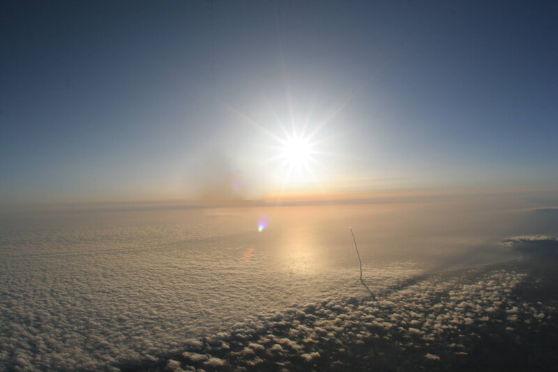 Sunrise over clouds from space