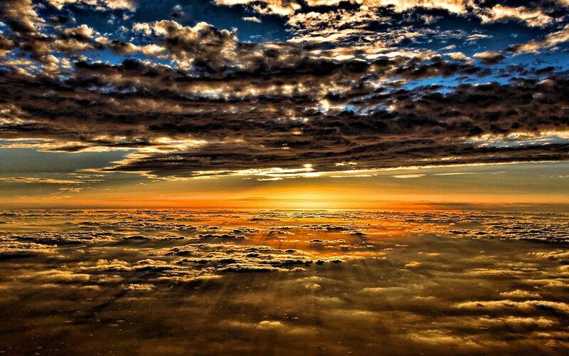 Sunrise over Clouds — Orange, Dramatic