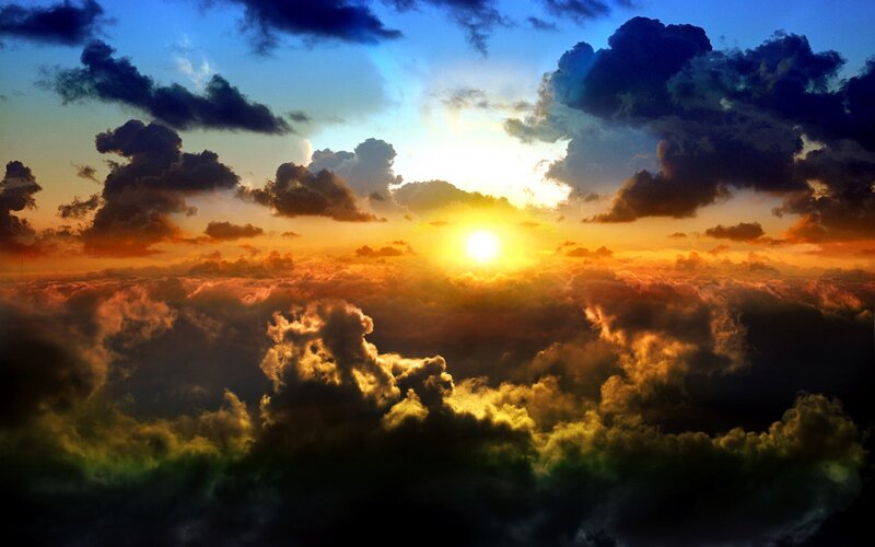 Sunrise over Clouds — Photograph