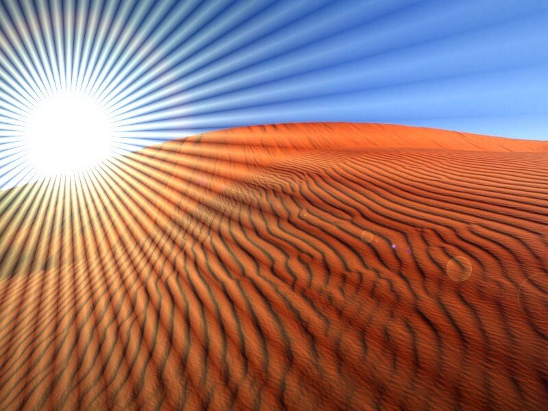 Sunrise over desert dunes