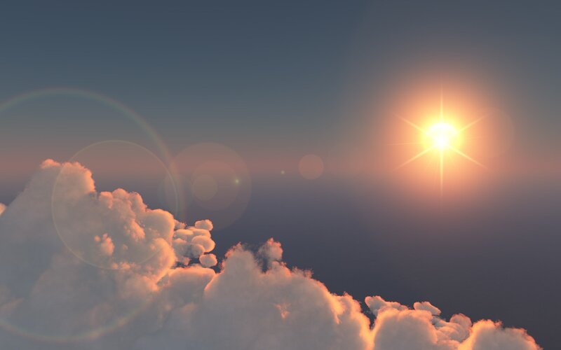 Sunrise over fluffy clouds