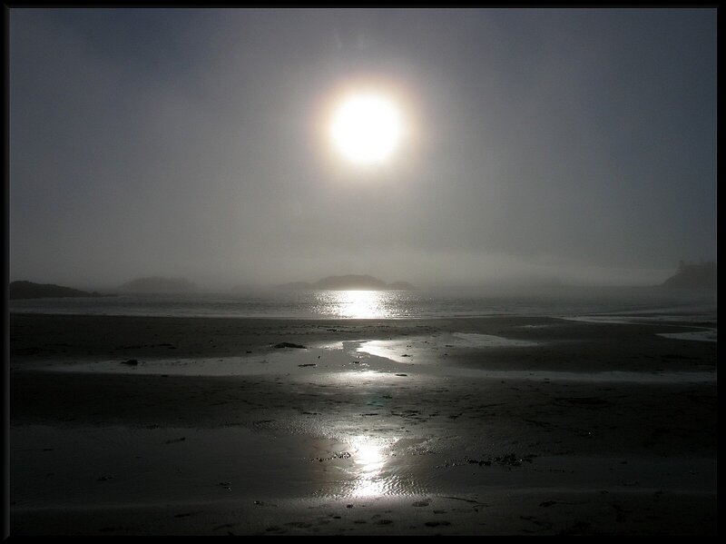 Sunrise over foggy beach
