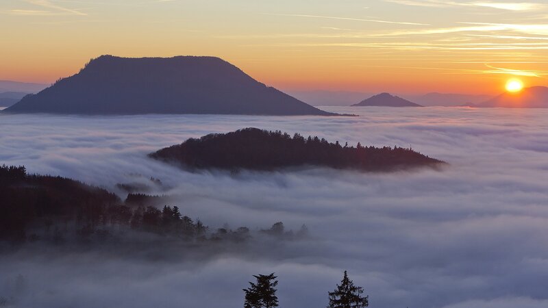 Sunrise over foggy mountains
