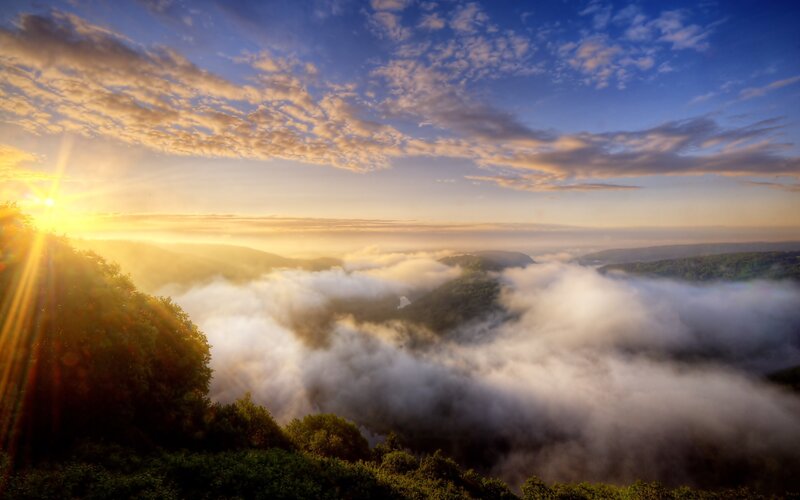Sunrise over Foggy Valley — Blue, Serene, Photograph, Sun, Clouds