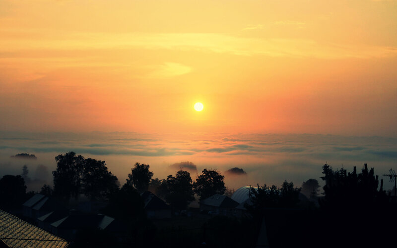 Sunrise over Foggy Village