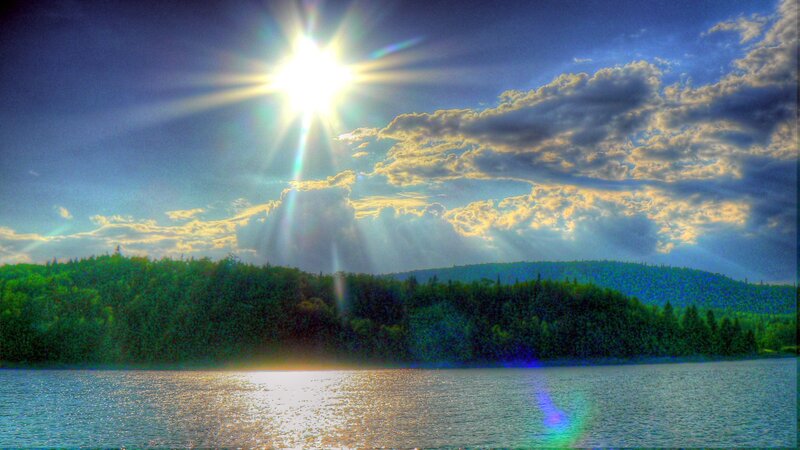 Sunrise over forest lake