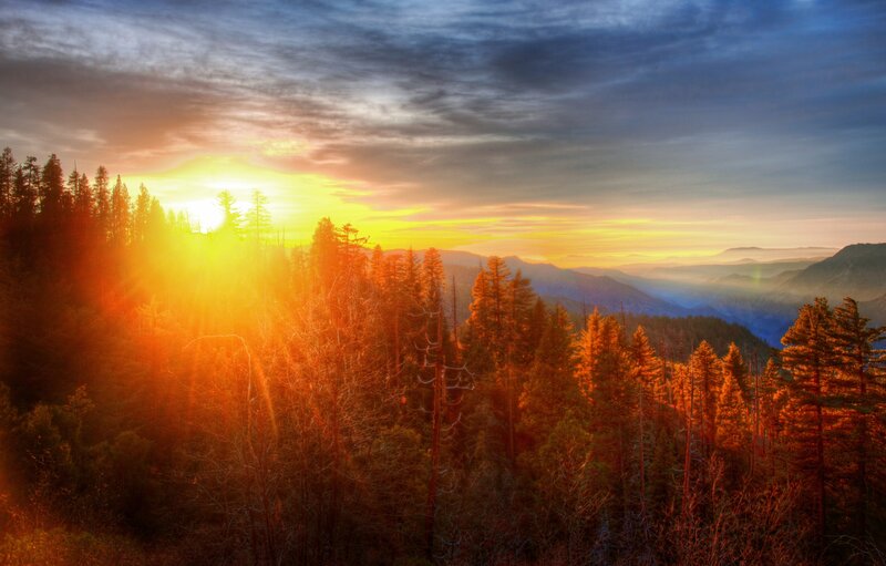 Sunrise over Forested Mountains — Orange, Dramatic, Photograph