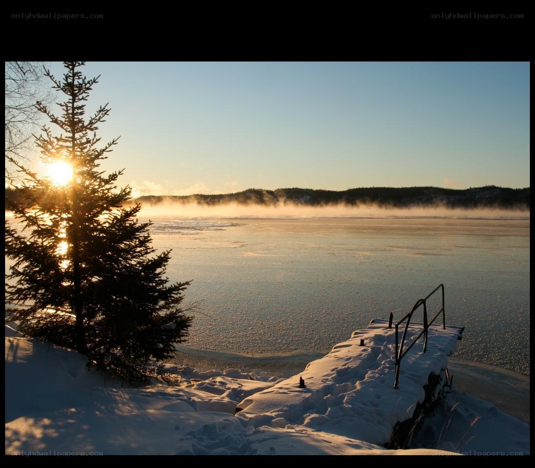 Sunrise over frozen lake