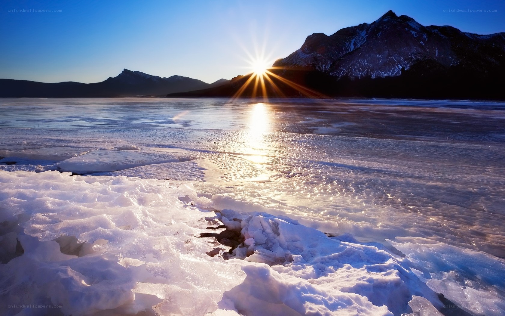 Sunrise over frozen lake