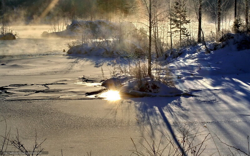 Sunrise over frozen river