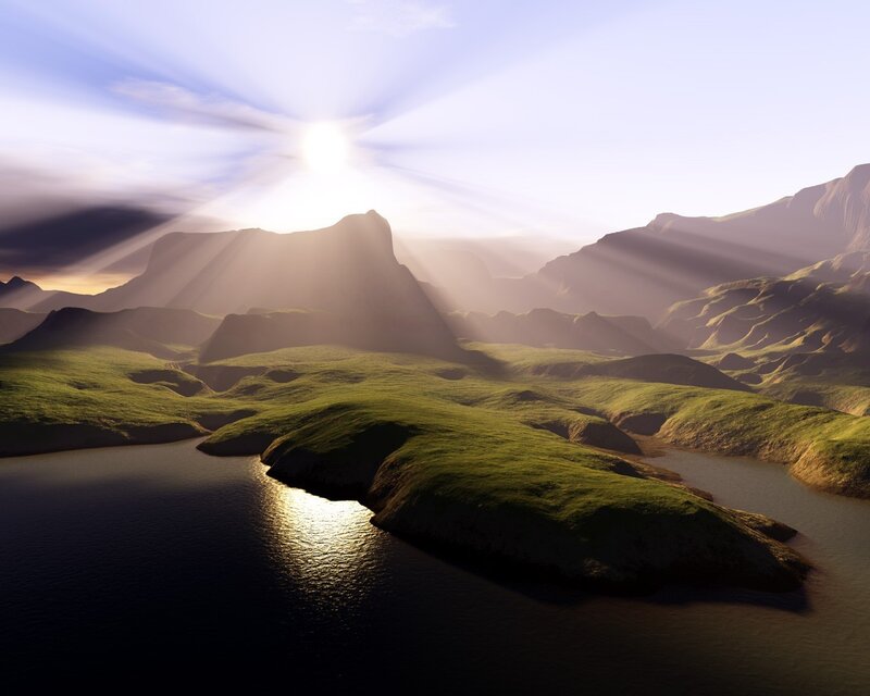 Sunrise over green hills and lake