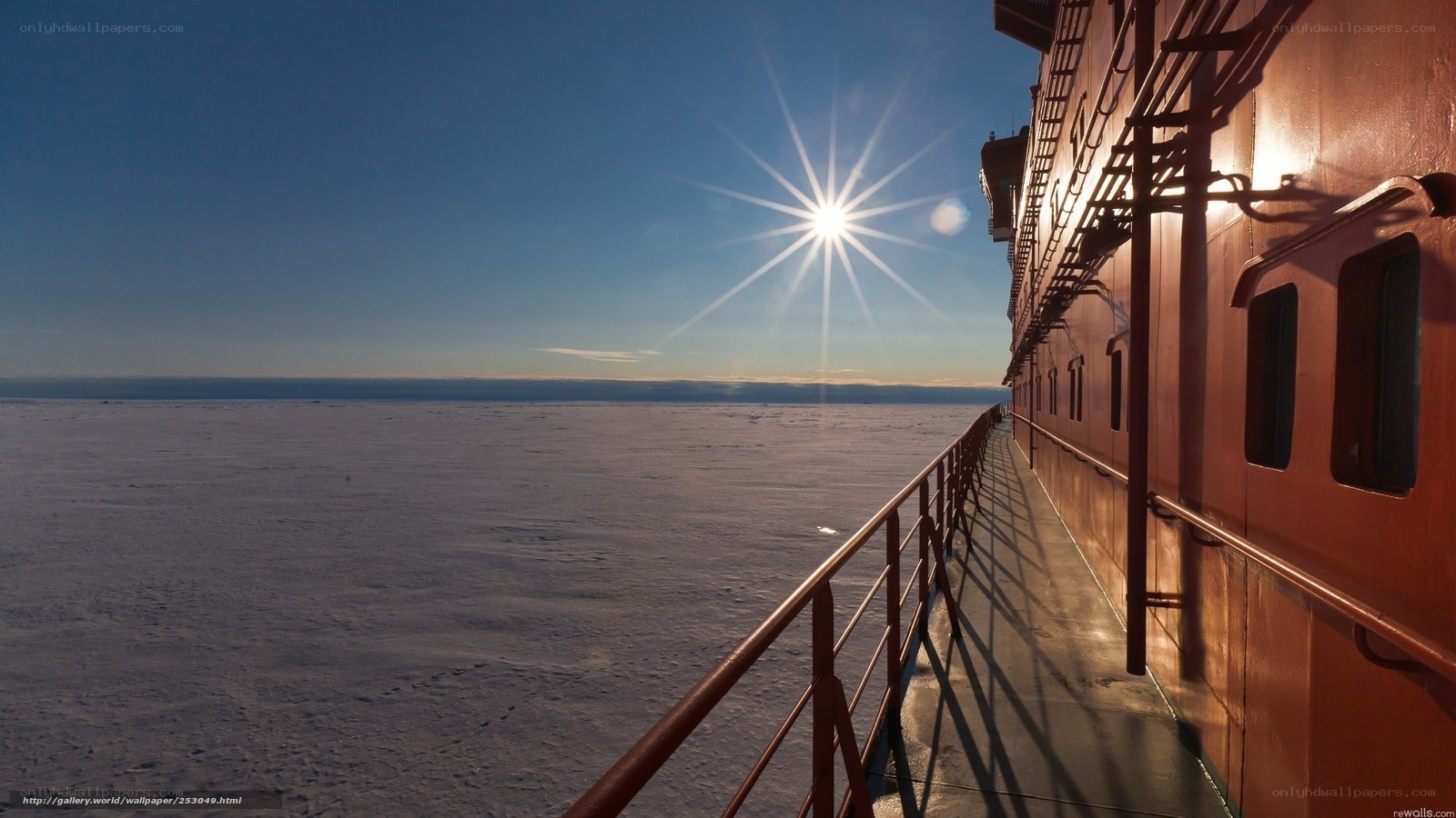 Sunrise over ice with ship
