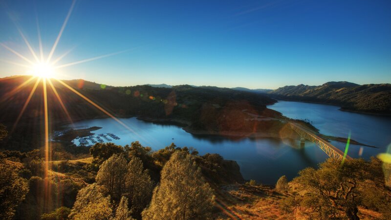 Sunrise over Lake and Bridge — Blue, Serene