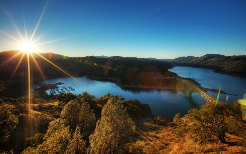 Sunrise over Lake and Bridge