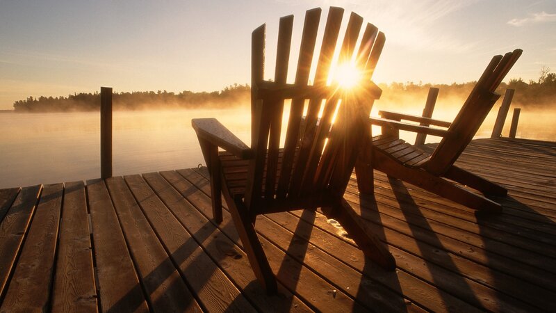 Sunrise over lake dock