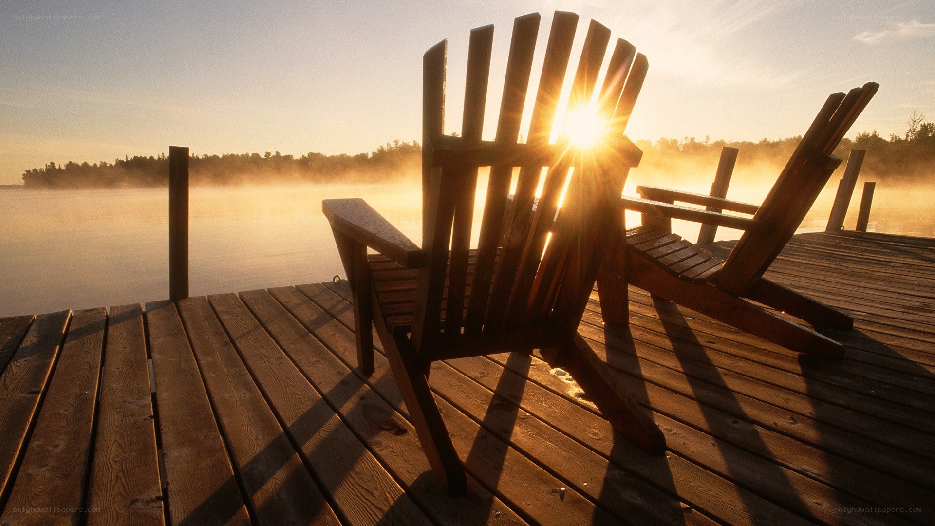 Sunrise over lake dock