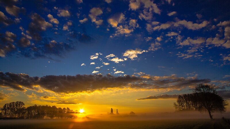 Sunrise over Misty Field — Blue, Serene, Photograph