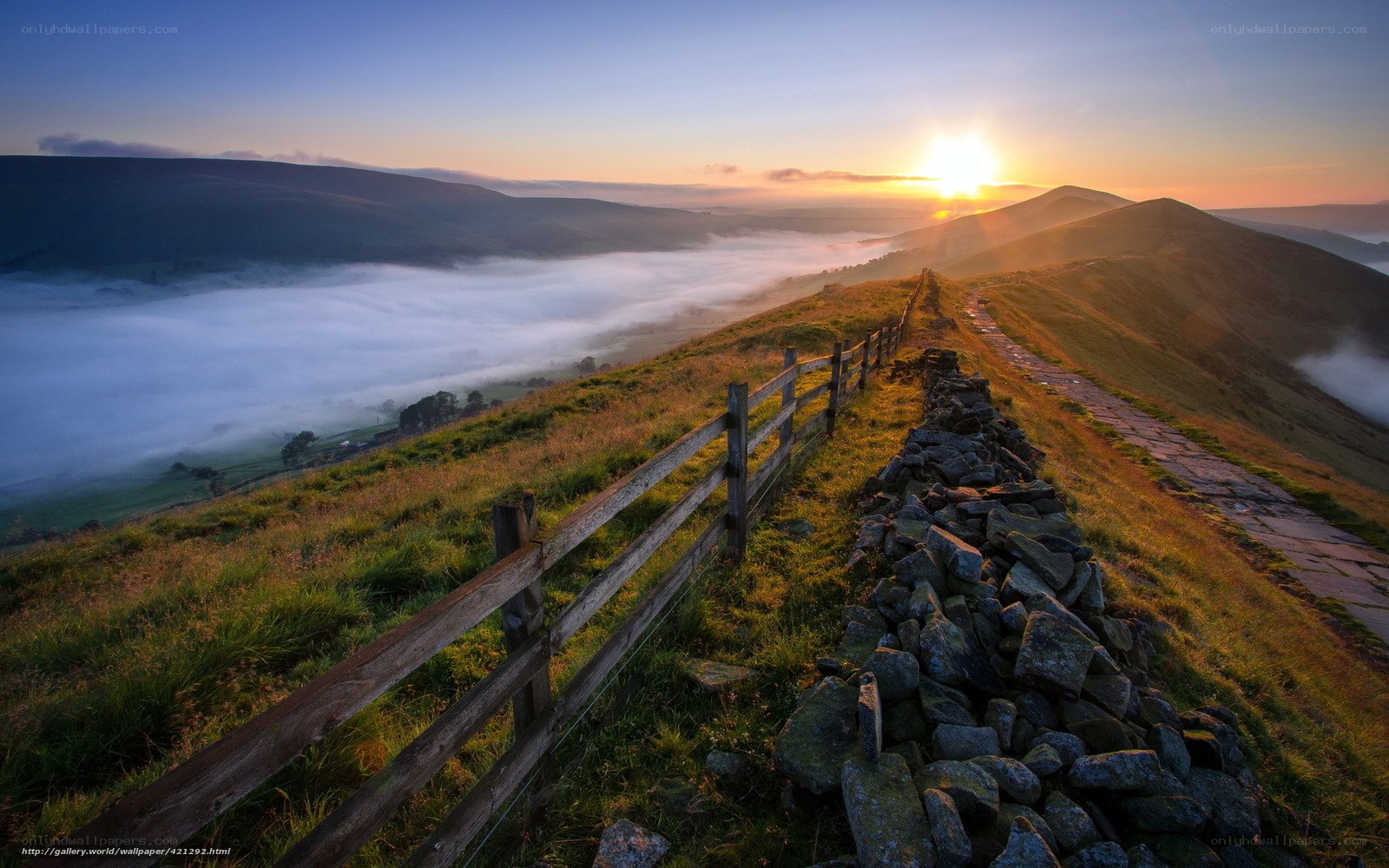 Sunrise over misty hills