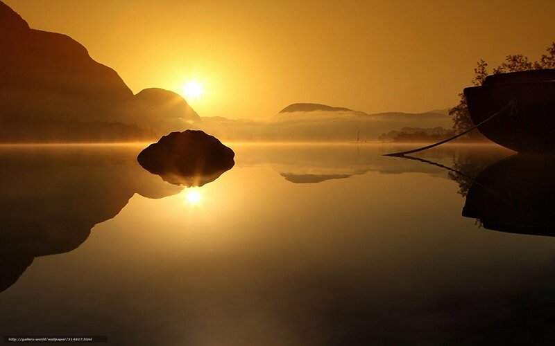 Sunrise over misty lake