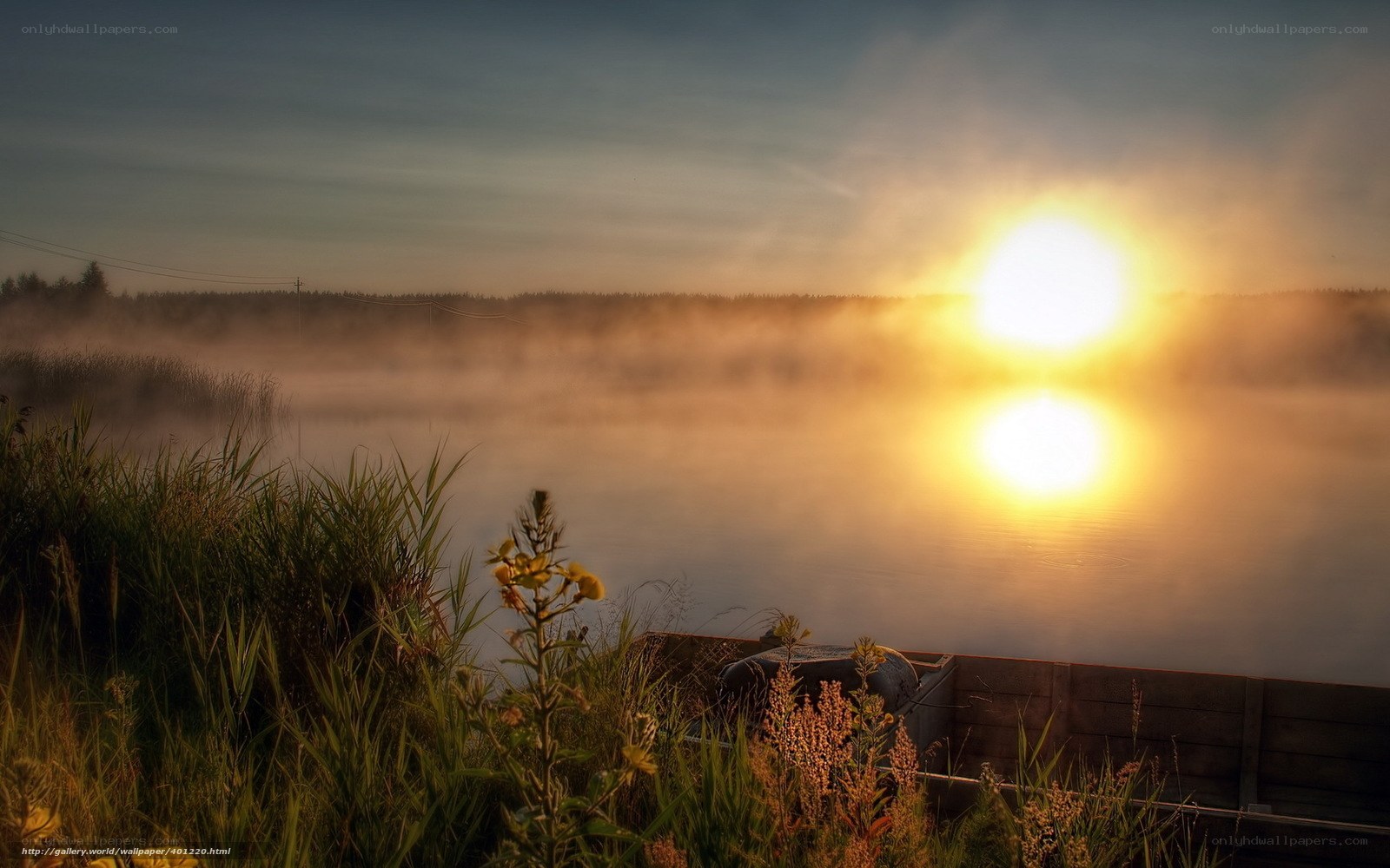 Sunrise over misty lake