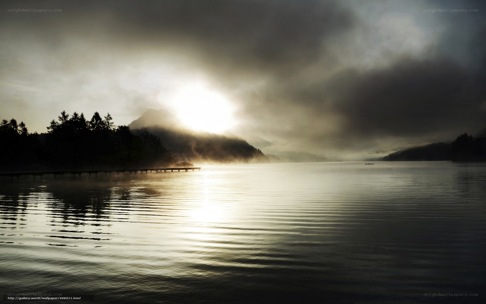 Sunrise over misty lake