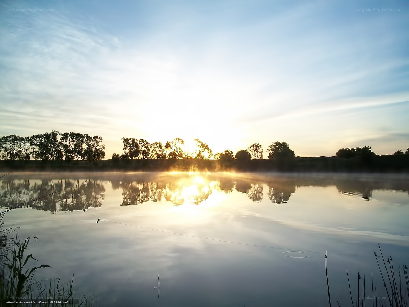 Sunrise over misty lake