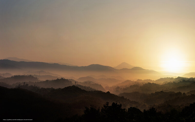 Sunrise over misty mountains