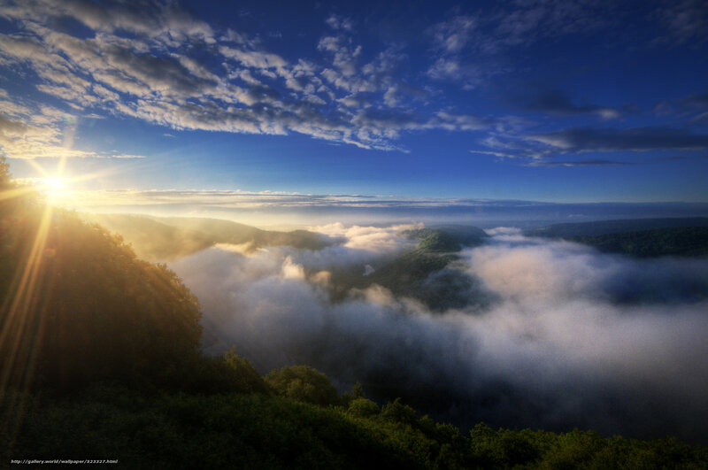 Sunrise over misty mountains