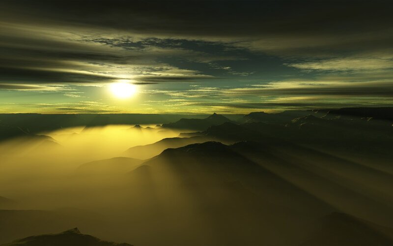 Sunrise over misty mountains