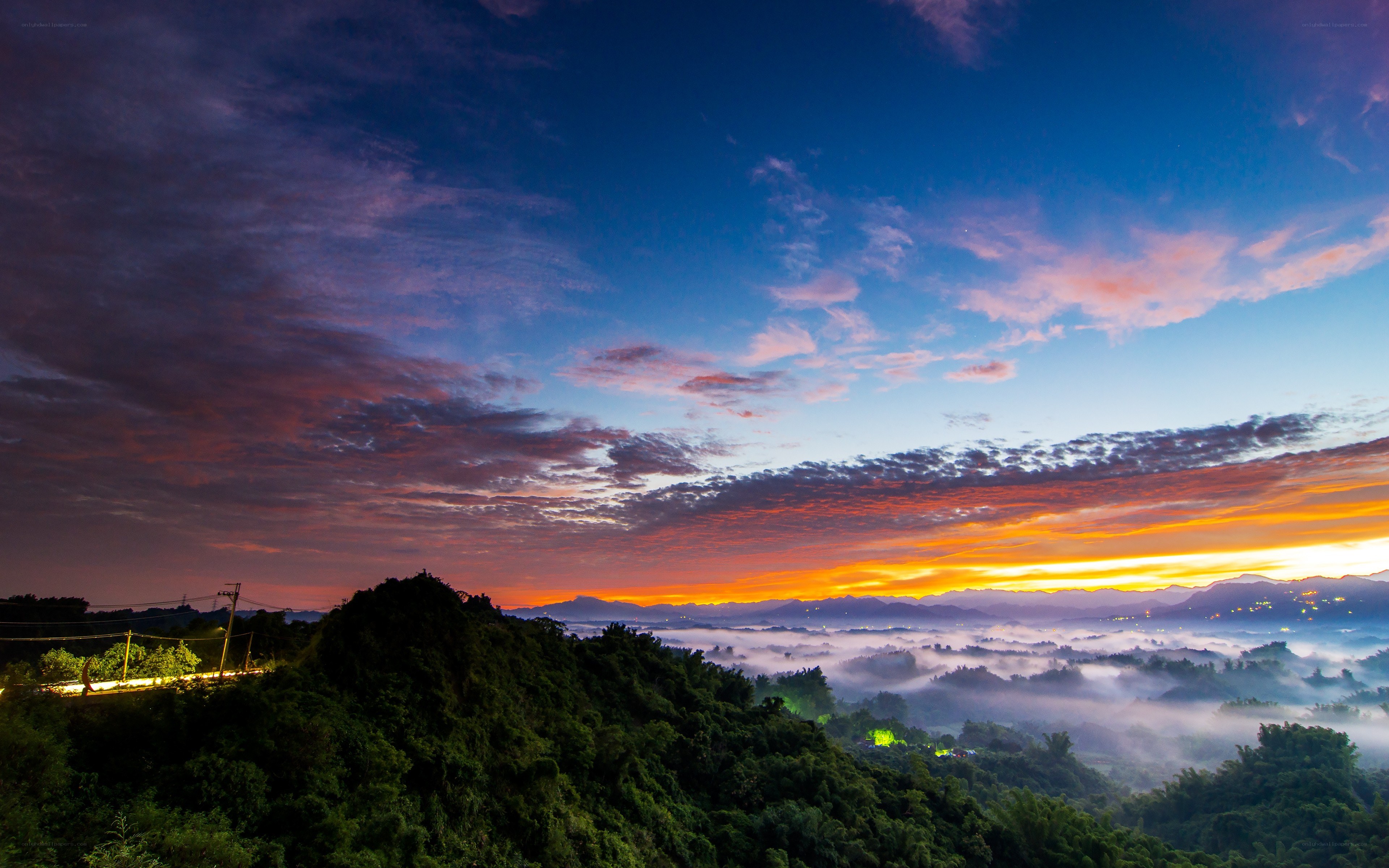 Sunrise over misty mountains