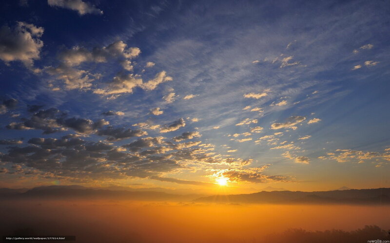 Sunrise over misty mountains